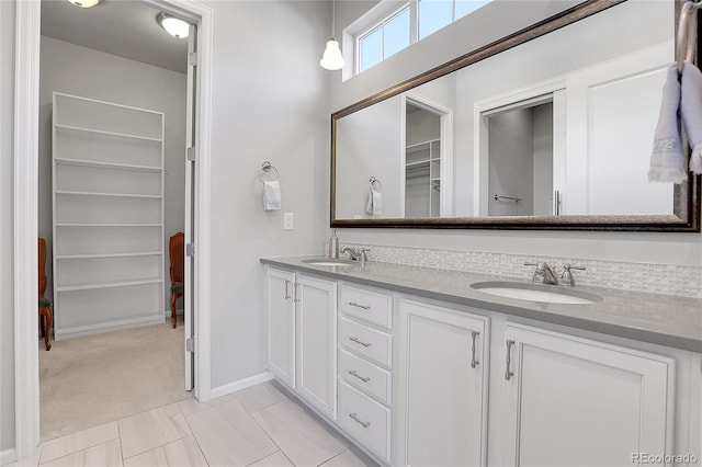 bathroom with tile patterned floors and vanity