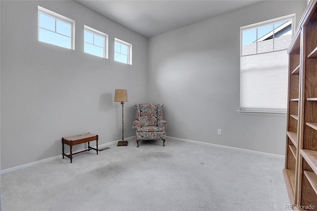 unfurnished room featuring light carpet