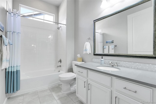 full bathroom featuring vanity, tile patterned floors, toilet, and shower / tub combo with curtain