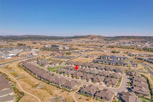 birds eye view of property featuring a mountain view