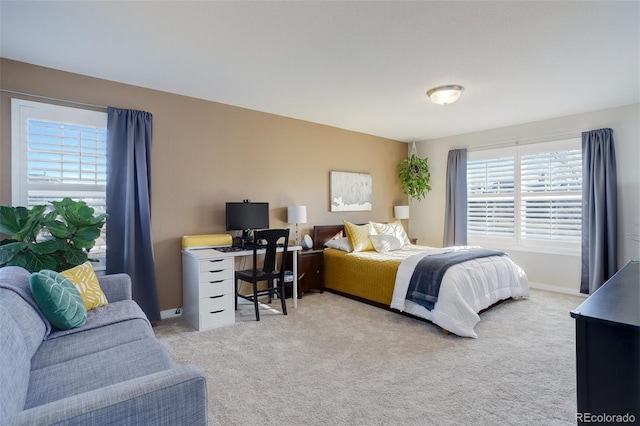 bedroom with carpet flooring and baseboards