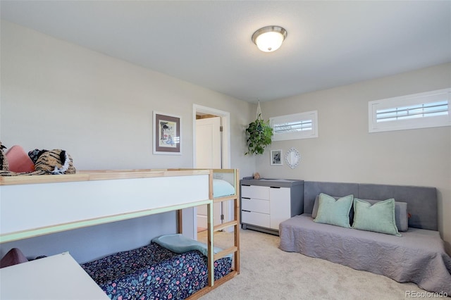 bedroom with light colored carpet