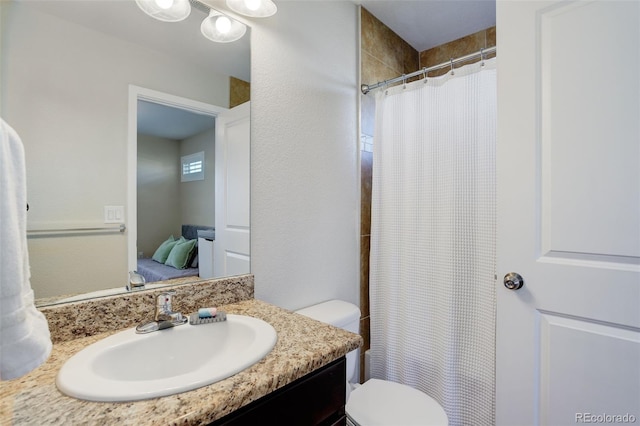 bathroom with vanity, toilet, and a shower with curtain