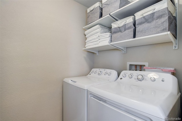 clothes washing area with laundry area and washing machine and clothes dryer