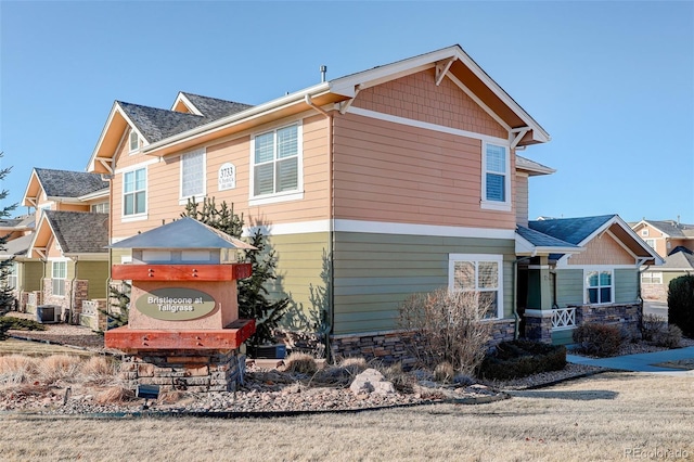 craftsman-style house featuring cooling unit