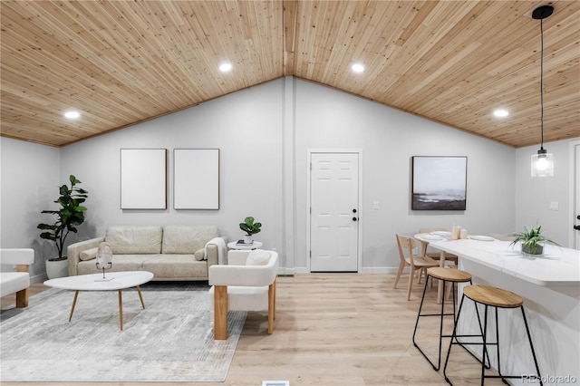 living room featuring light hardwood / wood-style flooring, wooden ceiling, and vaulted ceiling