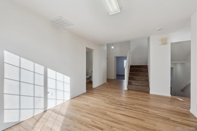 unfurnished living room with light hardwood / wood-style floors