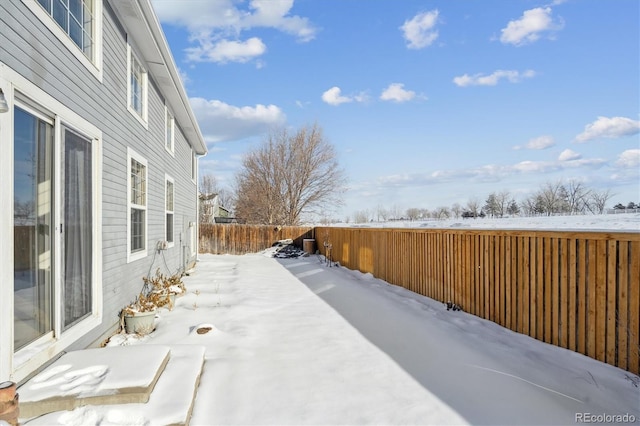 view of yard covered in snow