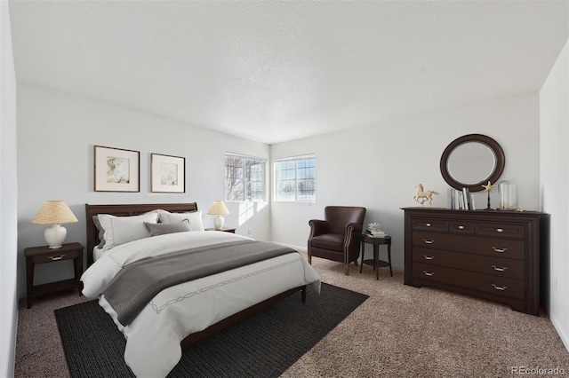 carpeted bedroom featuring a textured ceiling