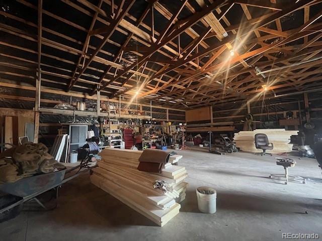 misc room with a workshop area and concrete flooring