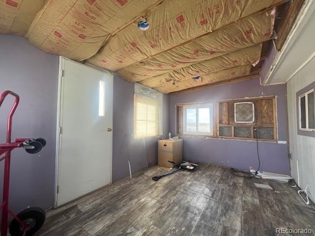 misc room featuring dark hardwood / wood-style floors and vaulted ceiling