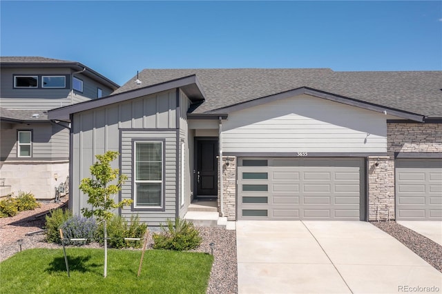 view of front of home featuring a garage and a front lawn