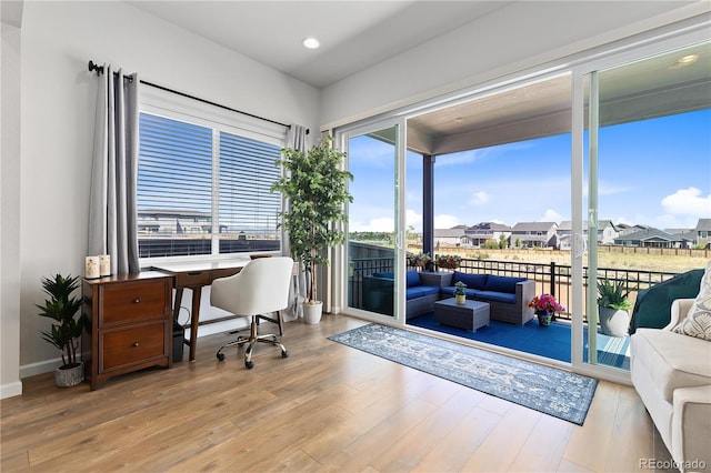 office area with light hardwood / wood-style flooring