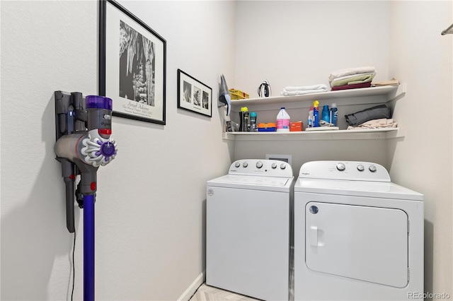 washroom with washing machine and dryer