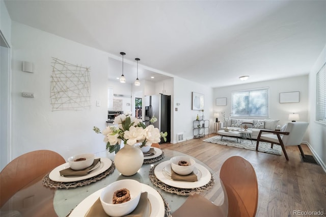 7275 E 8th Ave, Denver, CO 80220 - dining space featuring wood finished floors and baseboards