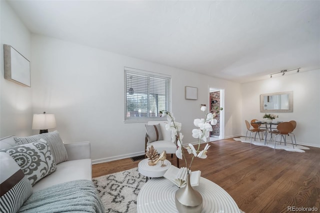 7275 E 8th Ave, Denver, CO 80220 - living room featuring wood finished floors and baseboards