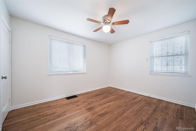 7275 E 8th Ave, Denver, CO 80220 - empty room featuring wood finished floors, a ceiling fan, and baseboards