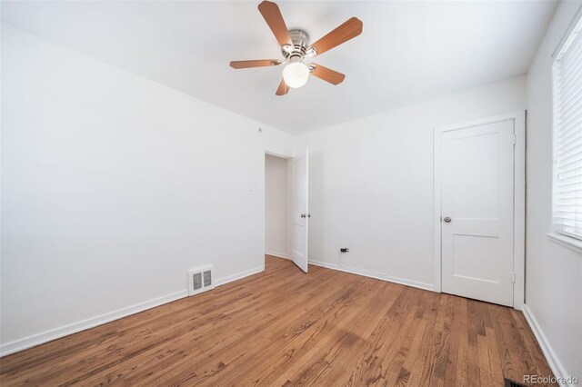 7275 E 8th Ave, Denver, CO 80220 - unfurnished room with wood finished floors, ceiling fan, and baseboards