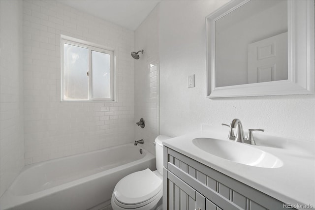 full bathroom with vanity, toilet, and tiled shower / bath