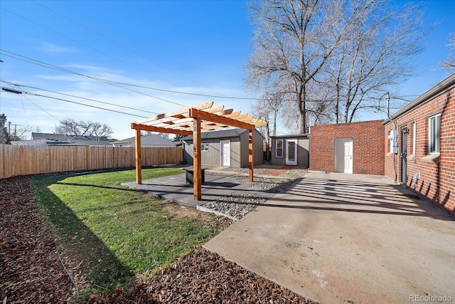 view of yard featuring a pergola, a patio, and a storage unit