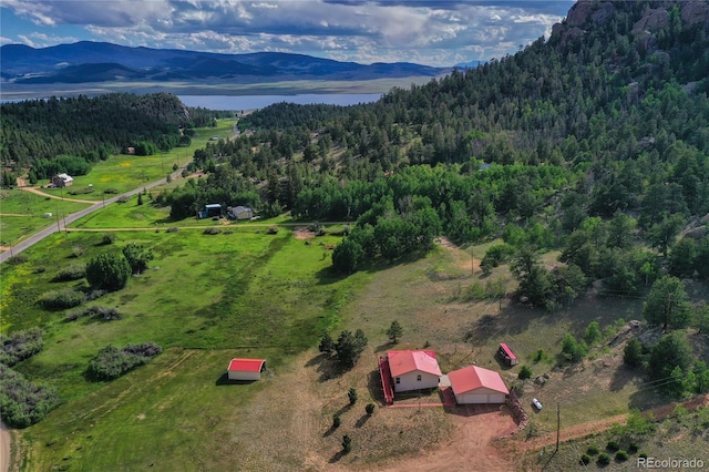 birds eye view of property featuring a water and mountain view