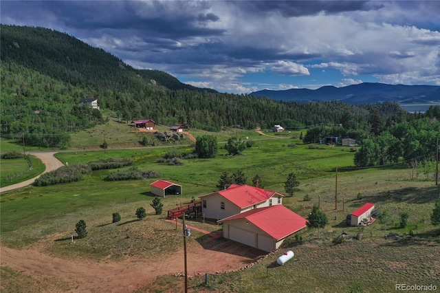 mountain view featuring a rural view