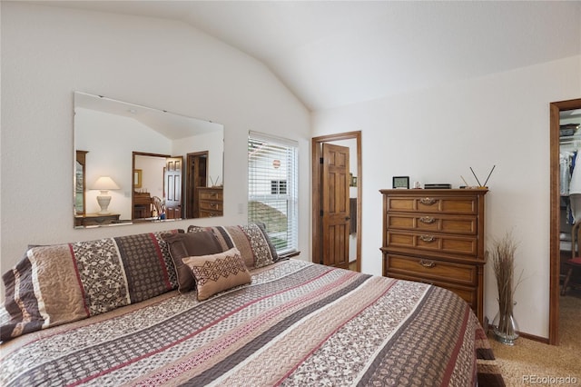 carpeted bedroom featuring vaulted ceiling