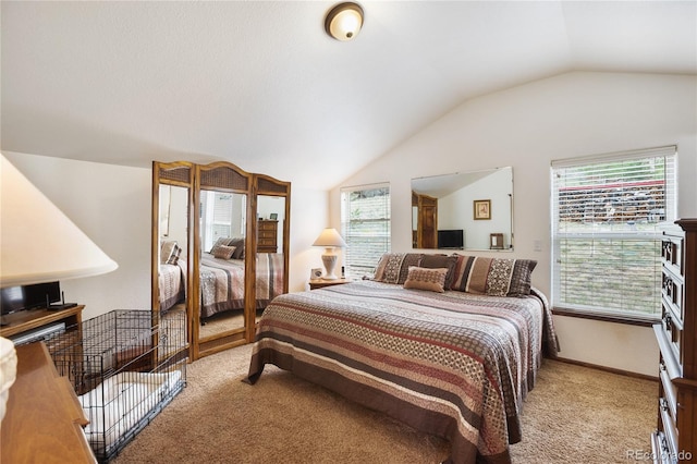 carpeted bedroom featuring vaulted ceiling