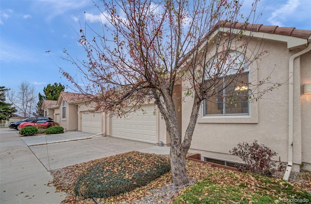 view of side of home with a garage