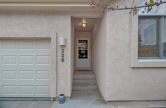 entrance to property featuring a garage