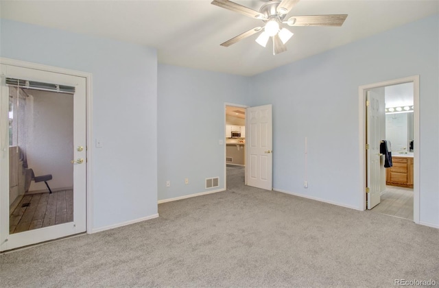 unfurnished bedroom with a closet, light carpet, and ceiling fan