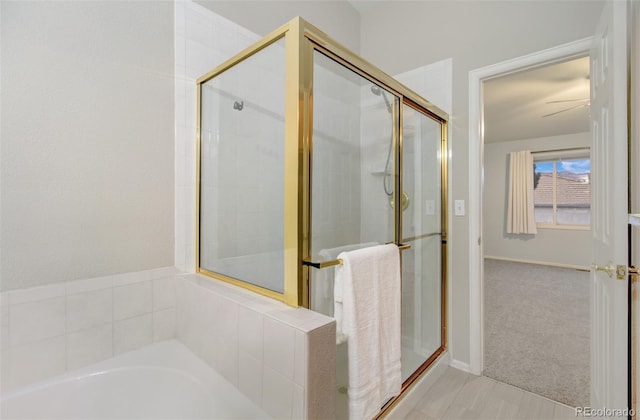 bathroom with shower with separate bathtub