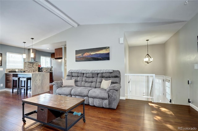 4833 S Pitkin Ct, Aurora, CO 80015 - living room with dark wood-style floors and baseboards