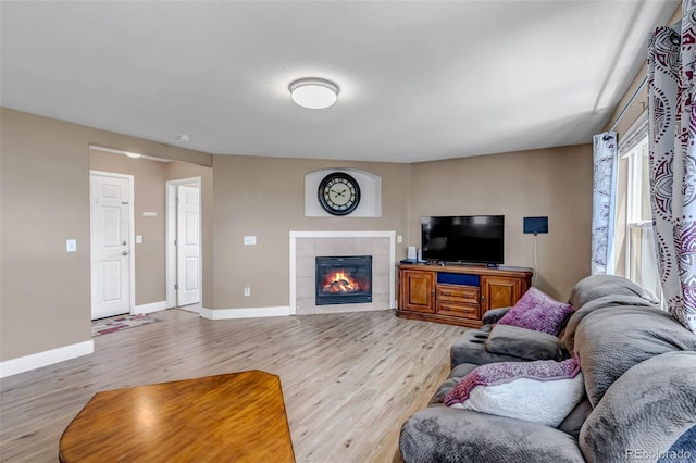 16352 E 104th Way, Commerce City, CO 80022 - living area with light wood-style floors and a fireplace