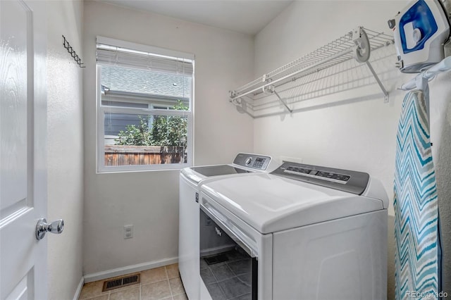 16352 E 104th Way, Commerce City, CO 80022 - washroom featuring separate washer and dryer and light tile patterned floors