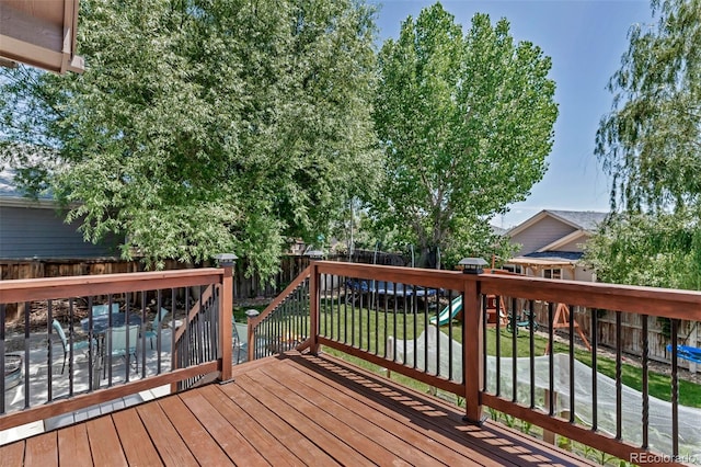 16352 E 104th Way, Commerce City, CO 80022 - wooden terrace featuring a fenced backyard