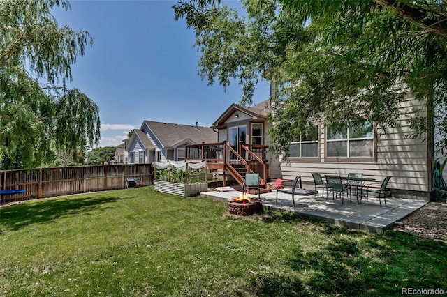 16352 E 104th Way, Commerce City, CO 80022 - back of house featuring a fire pit, a patio, and a wooden deck