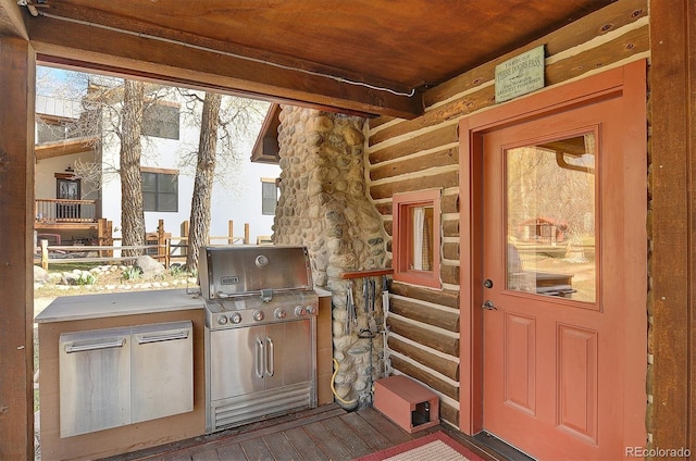 exterior space with exterior kitchen and stone siding