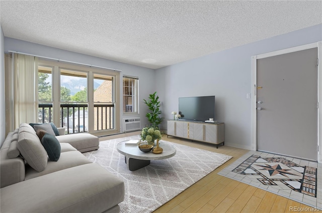 850 W Moorhead Cir Unit 3L, Boulder, CO 80305 - living room with hardwood / wood-style floors and a textured ceiling