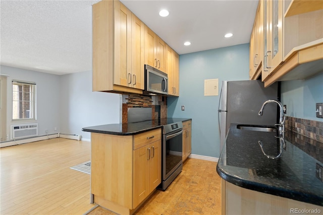 850 W Moorhead Cir Unit 3L, Boulder, CO 80305 - kitchen featuring stainless steel appliances, decorative backsplash, light wood finished floors, and recessed lighting
