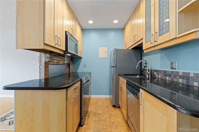850 W Moorhead Cir Unit 3L, Boulder, CO 80305 - kitchen featuring stainless steel appliances, light brown cabinetry, recessed lighting, dark stone countertops, and glass insert cabinets