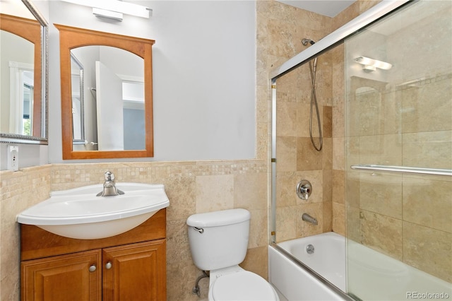 850 W Moorhead Cir Unit 3L, Boulder, CO 80305 - bathroom with vanity, bath / shower combo with glass door, wainscoting, and tile walls