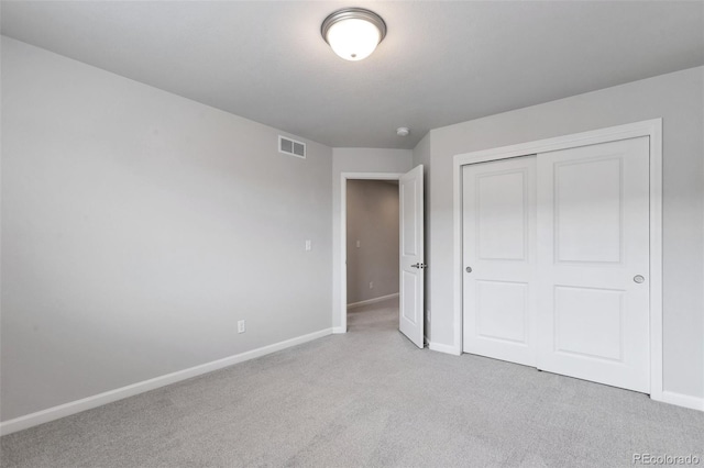 2561 Stage Coach Dr Unit B, Milliken, CO 80543 - unfurnished bedroom with carpet, baseboards, and a closet
