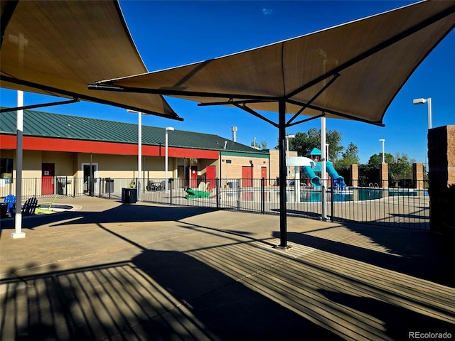 2561 Stage Coach Dr Unit B, Milliken, CO 80543 - view of community featuring a playground and a pool