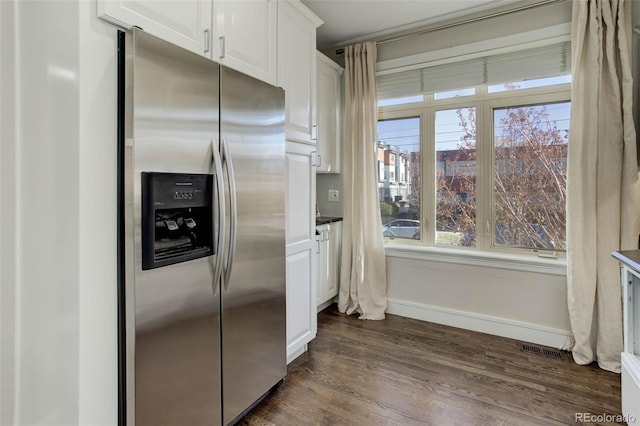 kitchen featuring white cabinetry, dark wood-type flooring, and stainless steel refrigerator with ice dispenser