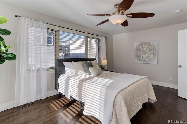 bedroom featuring ceiling fan and dark wood-type flooring