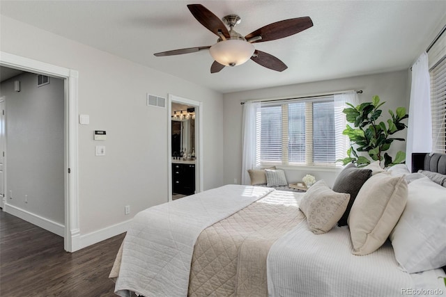 bedroom featuring ceiling fan, dark hardwood / wood-style flooring, and ensuite bathroom