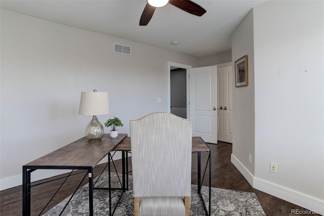 office space featuring dark hardwood / wood-style floors and ceiling fan