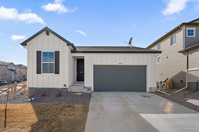 view of front of house with a garage, concrete driveway, and board and batten siding