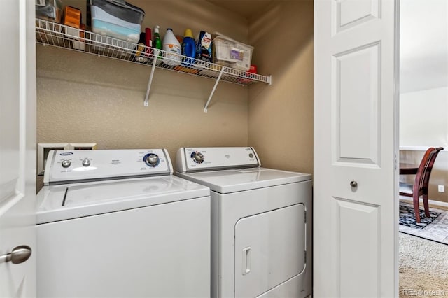 clothes washing area with independent washer and dryer